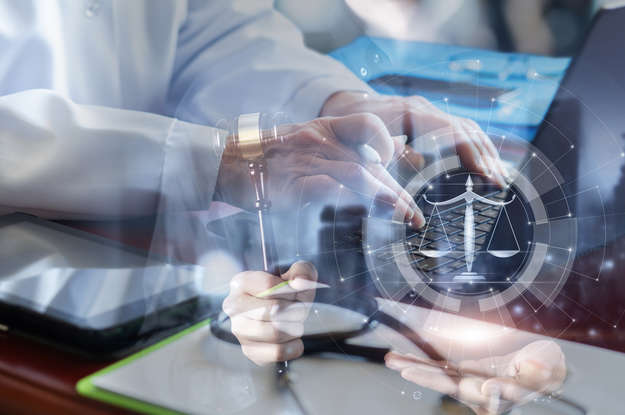 Professionals consulting with holographic scales of justice