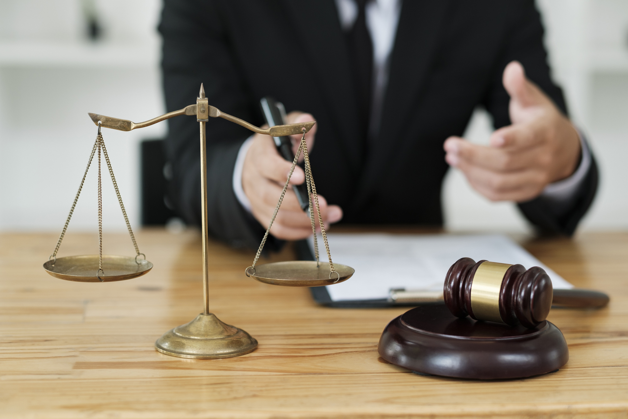 Scales of justice and gavel on desk